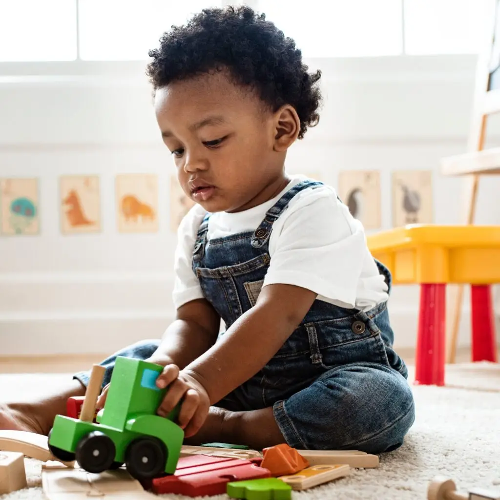 happy child playing with train